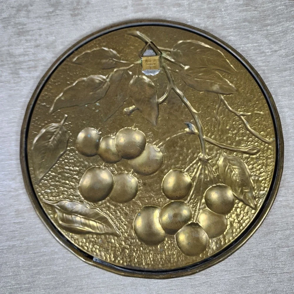 vintage embossed brass wall plaque with mid-century cherries made in Holland